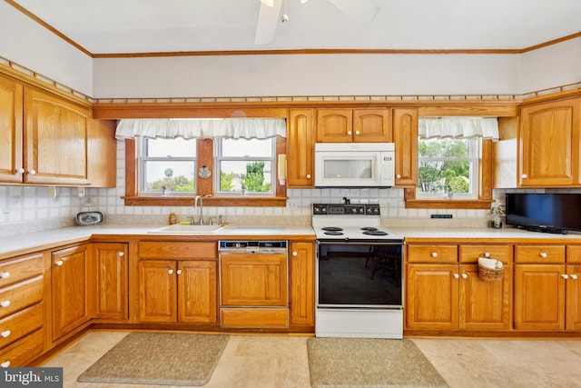 615 Convent Rd, Aston, PA 19014 - kitchen with white appliances, light countertops, crown molding, and backsplash