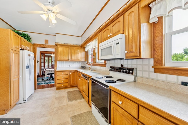 615 Convent Rd, Aston, PA 19014 - kitchen with white appliances, light countertops, backsplash, healthy amount of natural light, and ornamental molding