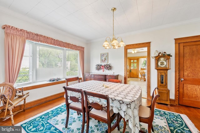 615 Convent Rd, Aston, PA 19014 - dining space with healthy amount of natural light, a chandelier, light wood-type flooring, and ornamental molding
