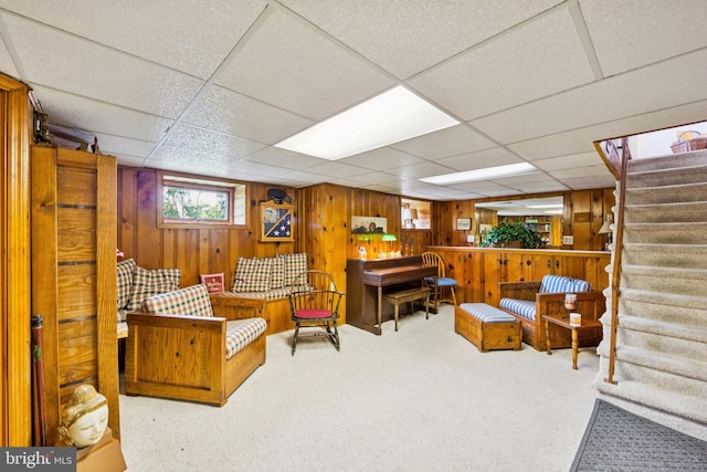 615 Convent Rd, Aston, PA 19014 - sitting room featuring stairway, carpet floors, wooden walls, and a drop ceiling