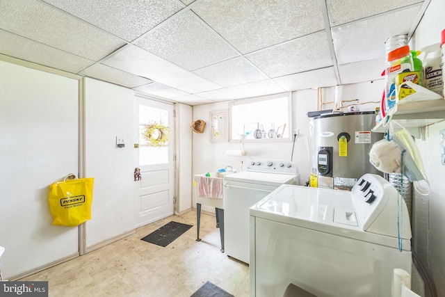 615 Convent Rd, Aston, PA 19014 - washroom with electric water heater and separate washer and dryer