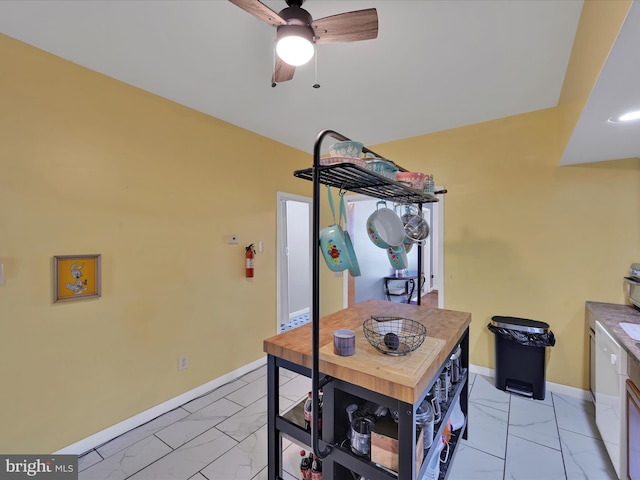 702 N Warren St, Orwigsburg, PA 17961 - dining space with light marble finish flooring and a ceiling fan