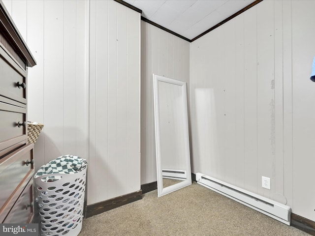 702 N Warren St, Orwigsburg, PA 17961 - interior space featuring baseboard heating, carpet, crown molding, and wood walls