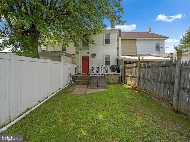 702 N Warren St, Orwigsburg, PA 17961 - back of house featuring a fenced backyard and a chimney