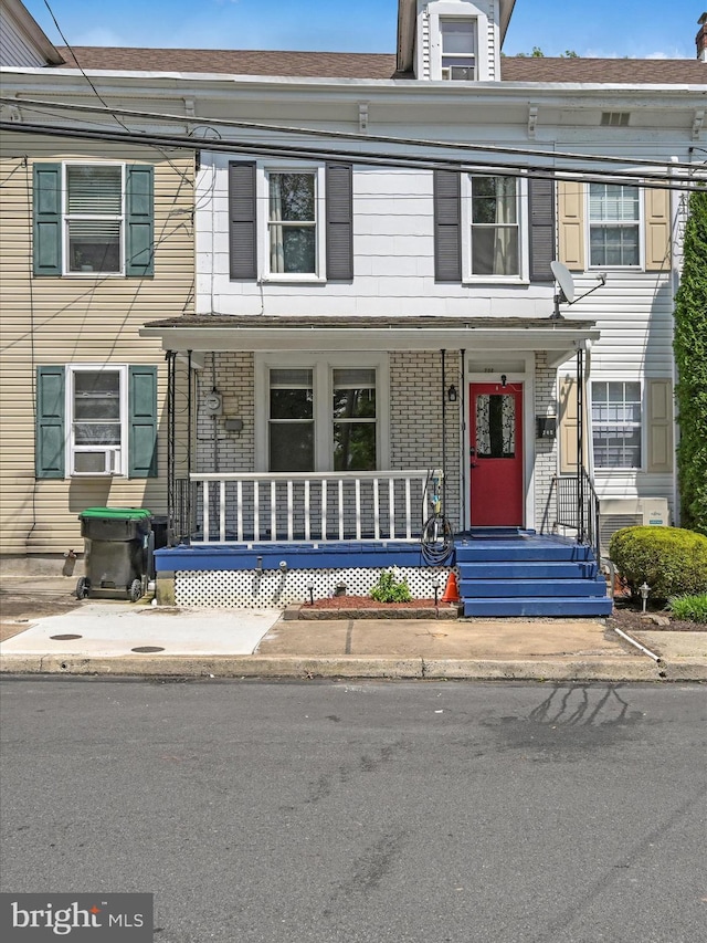 702 N Warren St, Orwigsburg, PA 17961 - townhome / multi-family property featuring covered porch