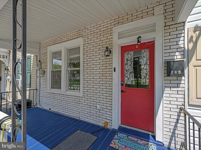 702 N Warren St, Orwigsburg, PA 17961 - property entrance with brick siding and a porch