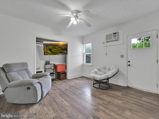 702 N Warren St, Orwigsburg, PA 17961 - living area featuring healthy amount of natural light, a ceiling fan, hardwood / wood-style flooring, and a wall mounted air conditioner