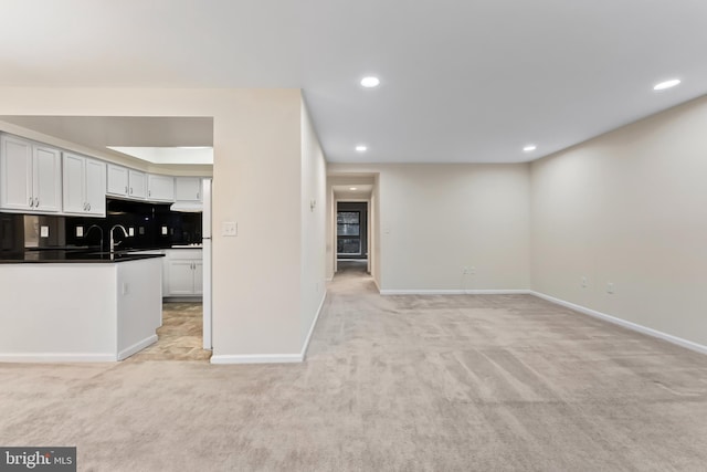 3622 Gleneagles Dr Unit 9-2C, Silver Spring, MD 20906 - kitchen featuring dark countertops, recessed lighting, light colored carpet, open floor plan, and white cabinets