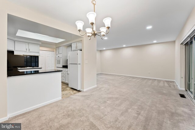 3622 Gleneagles Dr Unit 9-2C, Silver Spring, MD 20906 - kitchen featuring white appliances, dark countertops, light colored carpet, a chandelier, and under cabinet range hood