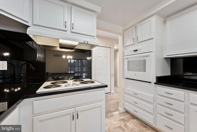3622 Gleneagles Dr Unit 9-2C, Silver Spring, MD 20906 - kitchen with white appliances, under cabinet range hood, white cabinets, and dark countertops
