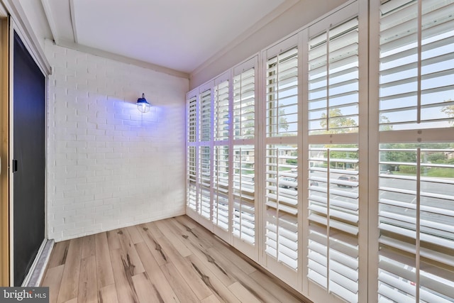 3622 Gleneagles Dr Unit 9-2C, Silver Spring, MD 20906 - unfurnished room featuring wood finished floors, healthy amount of natural light, and brick wall