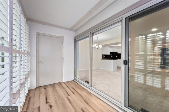 3622 Gleneagles Dr Unit 9-2C, Silver Spring, MD 20906 - entryway with light wood-type flooring and a chandelier