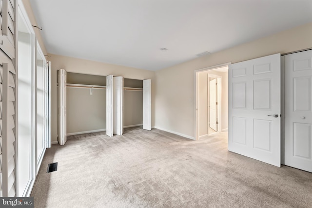 3622 Gleneagles Dr Unit 9-2C, Silver Spring, MD 20906 - unfurnished bedroom with carpet flooring and two closets