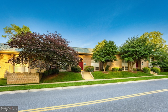 3622 Gleneagles Dr Unit 9-2C, Silver Spring, MD 20906 - view of property hidden behind natural elements featuring a standing seam roof, a front lawn, and a metal roof