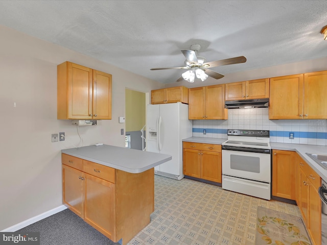 171 Tanglewood Ln, Lancaster, PA 17601 - kitchen with white appliances, under cabinet range hood, a peninsula, a ceiling fan, and light countertops