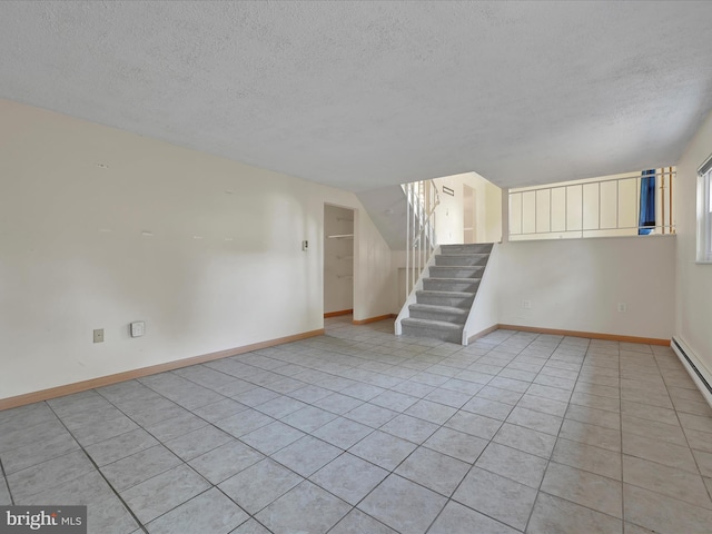 171 Tanglewood Ln, Lancaster, PA 17601 - unfurnished living room with a textured ceiling, stairs, and light tile patterned floors