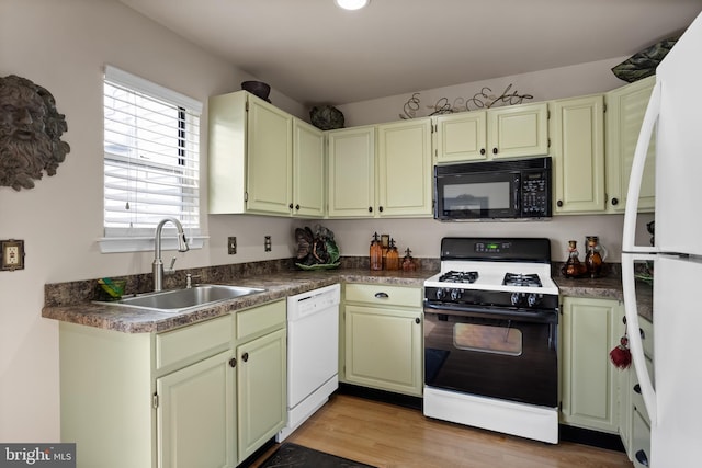 811 Darrett Ct, Sewell, NJ 08080 - kitchen with white appliances, dark countertops, and light wood-style floors