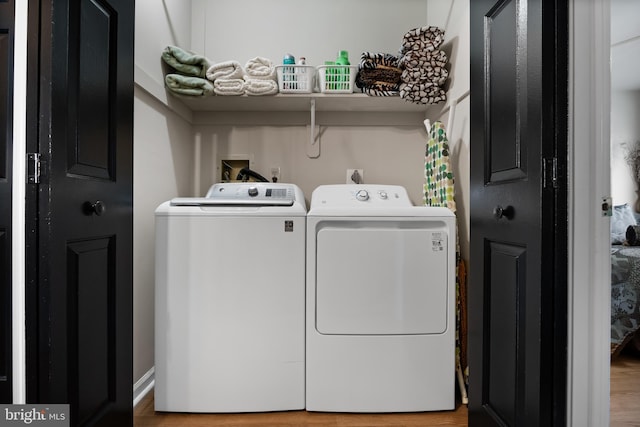 811 Darrett Ct, Sewell, NJ 08080 - laundry room featuring separate washer and dryer and wood finished floors