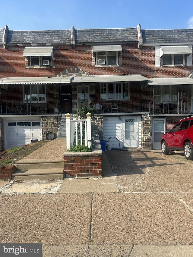 2847 S 65th St, Philadelphia, PA 19142 - view of property with mansard roof and brick siding