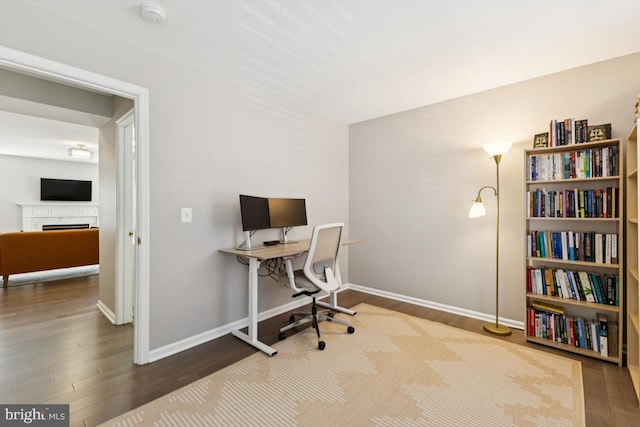 44203 Litchfield Ter, Ashburn, VA 20147 - office with wood finished floors and a fireplace
