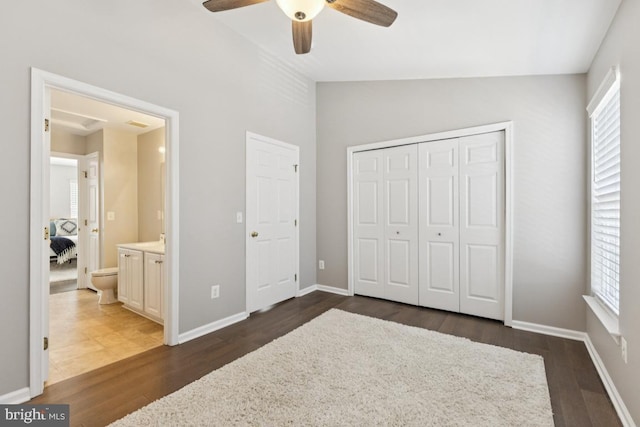 44203 Litchfield Ter, Ashburn, VA 20147 - unfurnished bedroom with dark wood-style floors, lofted ceiling, a closet, and a ceiling fan