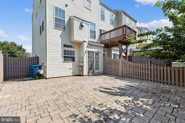44203 Litchfield Ter, Ashburn, VA 20147 - rear view of house with a patio area