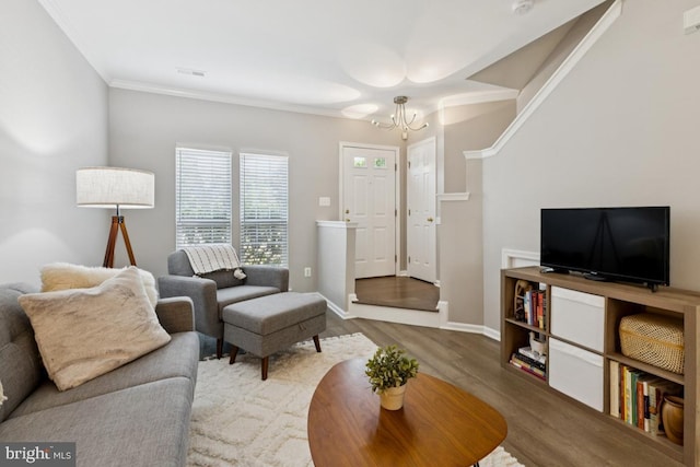 44203 Litchfield Ter, Ashburn, VA 20147 - living area with a chandelier, wood finished floors, and crown molding