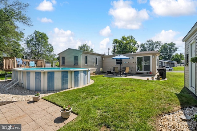 656 Windsor Ave, Maple Shade, NJ 08052 - outdoor pool with a lawn and a patio area