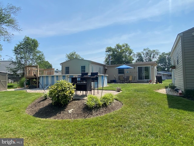656 Windsor Ave, Maple Shade, NJ 08052 - view of green lawn featuring a deck and a patio area