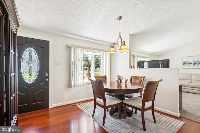 656 Windsor Ave, Maple Shade, NJ 08052 - dining area featuring a chandelier, a textured ceiling, and wood finished floors