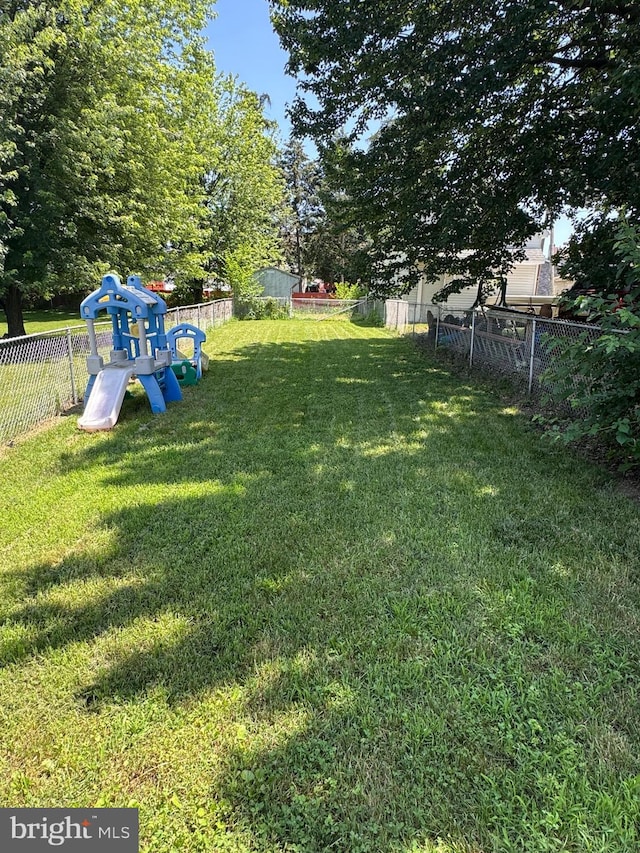 3319 Holtry St, Reading, PA 19605 - fenced backyard featuring a playground