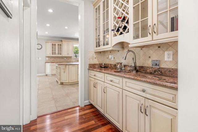 3213 Hatton Rd, Baltimore, MD 21208 - indoor wet bar with ornamental molding, tasteful backsplash, hardwood / wood-style floors, and recessed lighting