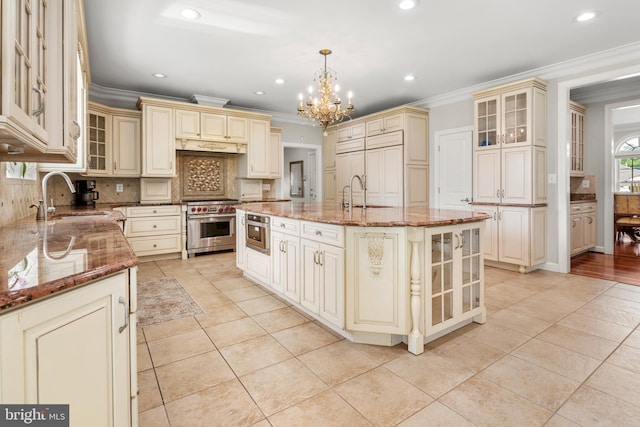 3213 Hatton Rd, Baltimore, MD 21208 - kitchen with cream cabinets, luxury range, a chandelier, ornamental molding, and light tile patterned floors
