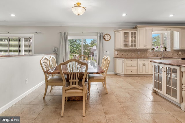 3213 Hatton Rd, Baltimore, MD 21208 - dining room featuring crown molding, recessed lighting, and light tile patterned flooring