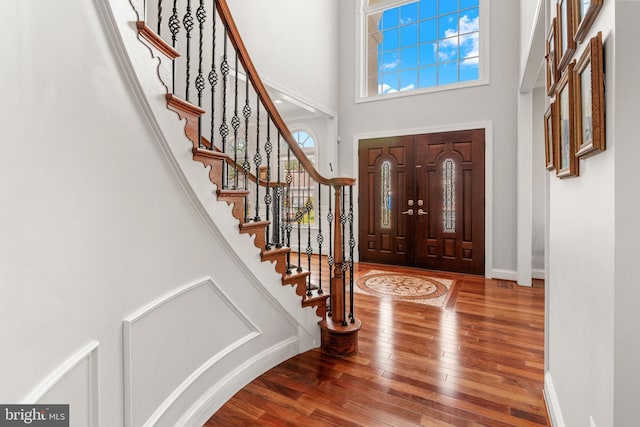 3213 Hatton Rd, Baltimore, MD 21208 - foyer with wood-type flooring, stairs, and a high ceiling