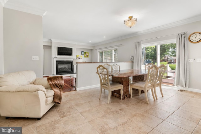 3213 Hatton Rd, Baltimore, MD 21208 - dining room featuring ornamental molding, a glass covered fireplace, light tile patterned floors, and recessed lighting