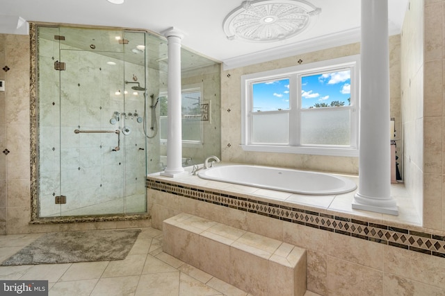 3213 Hatton Rd, Baltimore, MD 21208 - full bathroom featuring ornate columns, a garden tub, a stall shower, and tile patterned flooring