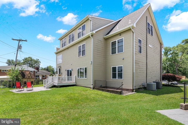 3213 Hatton Rd, Baltimore, MD 21208 - rear view of house with a patio area, a lawn, and a deck