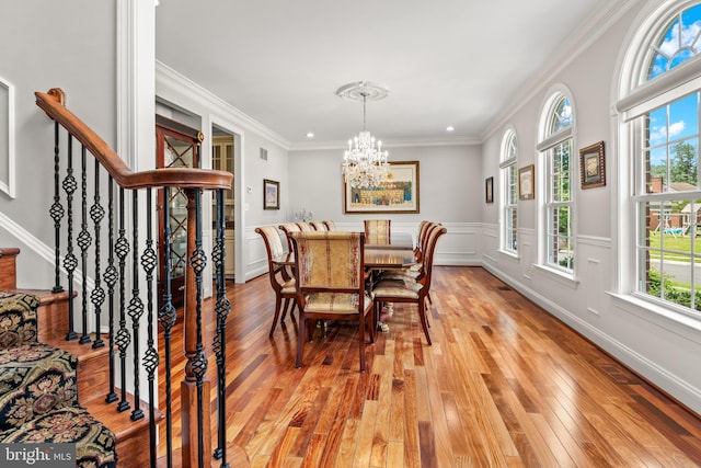 3213 Hatton Rd, Baltimore, MD 21208 - dining room with a chandelier, light wood finished floors, stairs, and crown molding