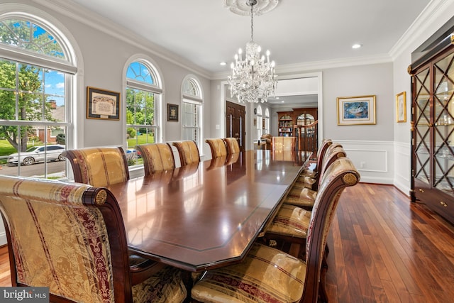 3213 Hatton Rd, Baltimore, MD 21208 - dining area featuring a chandelier, crown molding, wood-type flooring, wainscoting, and recessed lighting