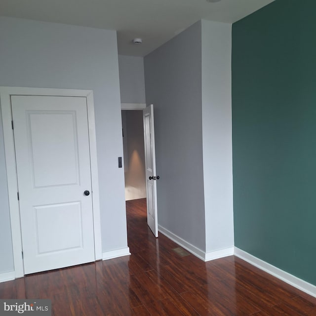 1716 N Monroe St, Baltimore, MD 21217 - unfurnished bedroom with wood finished floors and baseboards