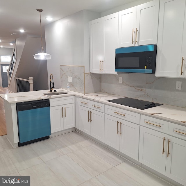 1716 N Monroe St, Baltimore, MD 21217 - kitchen with dishwashing machine, black electric cooktop, white cabinetry, and recessed lighting
