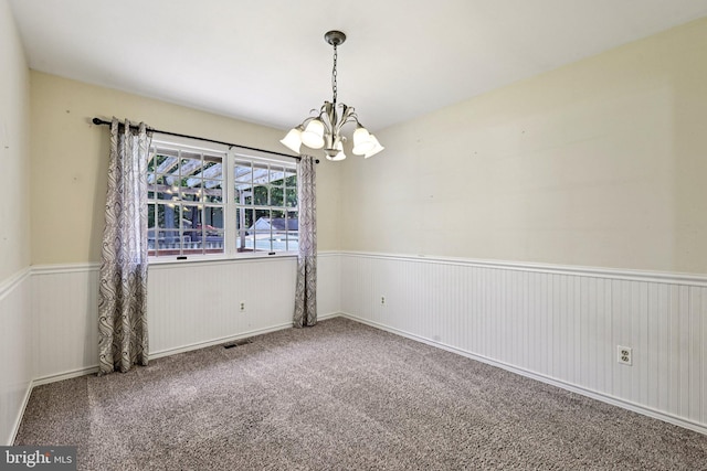 1207 Avalon Blvd, Shady Side, MD 20764 - carpeted empty room featuring a chandelier and a wainscoted wall