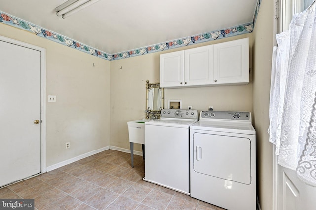1207 Avalon Blvd, Shady Side, MD 20764 - laundry area featuring cabinet space, washer and clothes dryer, and light tile patterned flooring