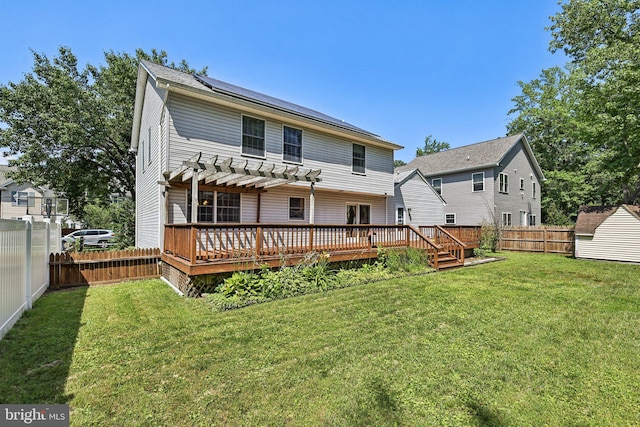 1207 Avalon Blvd, Shady Side, MD 20764 - rear view of property featuring a pergola, a fenced backyard, a wooden deck, and solar panels