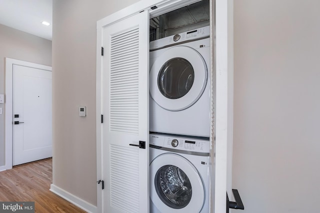 1358 Florida Ave NE Unit Ph-02, Washington, DC 20002 - laundry room featuring stacked washer and clothes dryer, wood finished floors, and recessed lighting