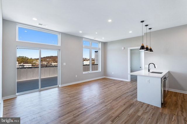 1358 Florida Ave NE Unit Ph-02, Washington, DC 20002 - kitchen featuring wood finished floors, pendant lighting, light countertops, recessed lighting, and dishwasher