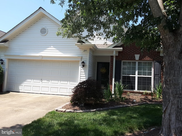 295 Bridgewater Cir, Fredericksburg, VA 22406 - view of front of property featuring a garage, concrete driveway, a shingled roof, and brick siding