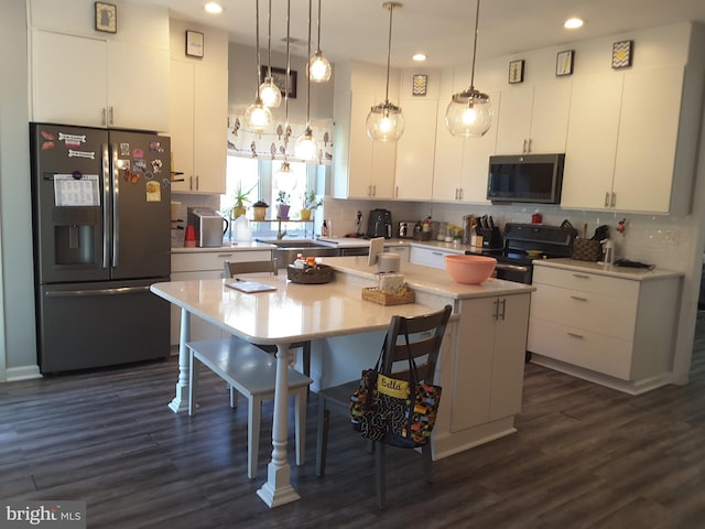 295 Bridgewater Cir, Fredericksburg, VA 22406 - kitchen with stainless steel appliances, white cabinetry, light countertops, decorative backsplash, and recessed lighting