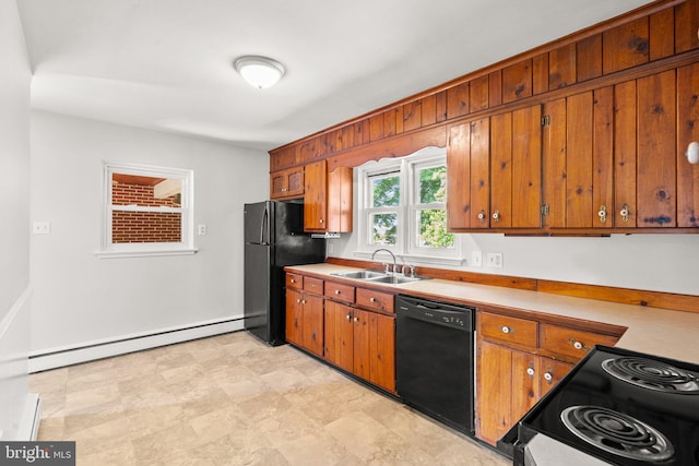 102 Deaven Rd, Harrisburg, PA 17112 - kitchen with black appliances, baseboard heating, brown cabinetry, and light countertops